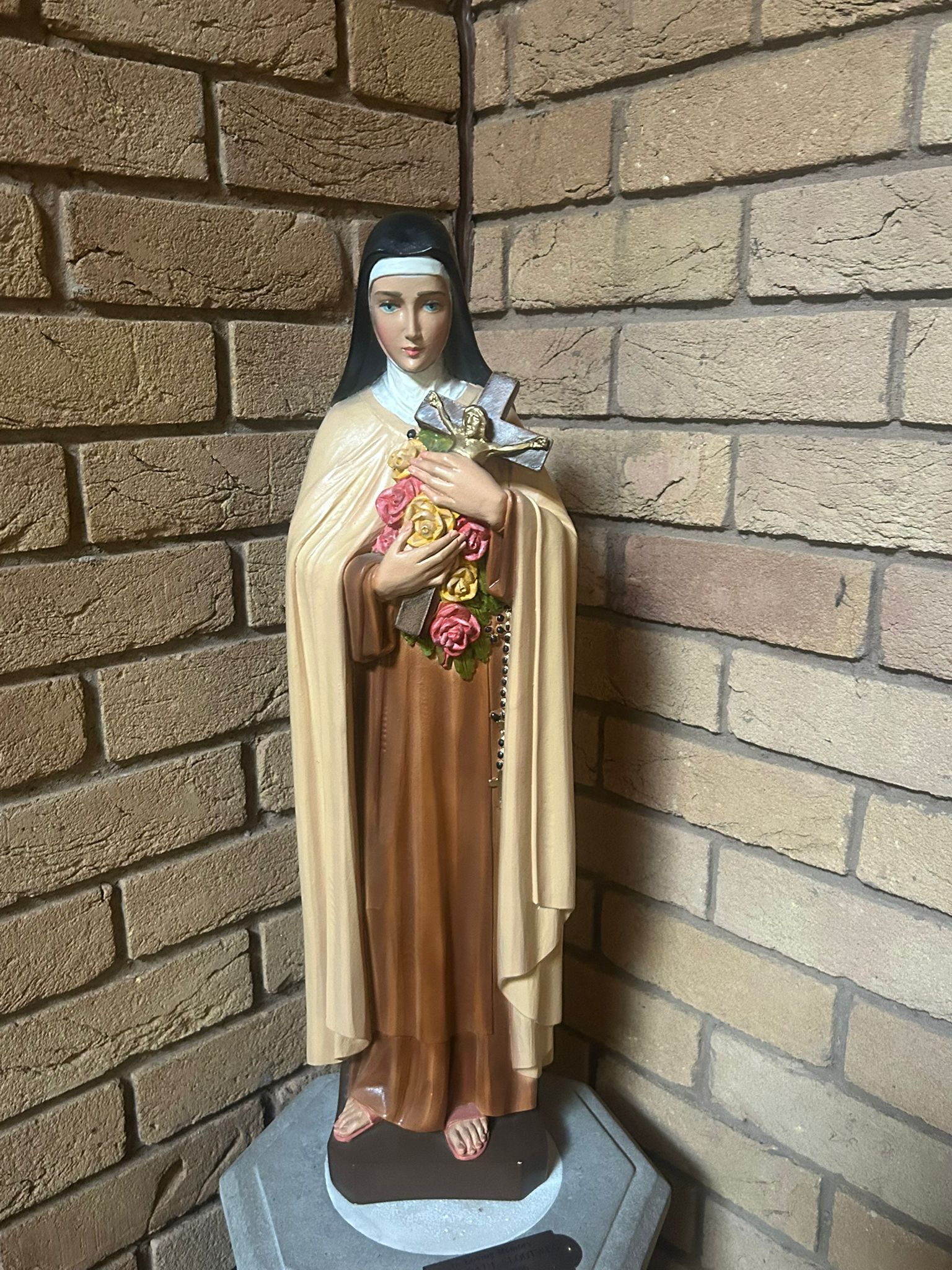 Statue of St Thérèse of Lisieux at the church entrance